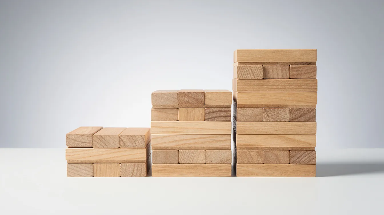 The image depicts stacked wooden blocks arranged in three tiers of varying heights, symbolizing the tiered structure of an account based marketing (ABM) strategy. This visual representation highlights the importance of targeting high value accounts and aligning sales and marketing teams to enhance customer relationships and drive business growth.